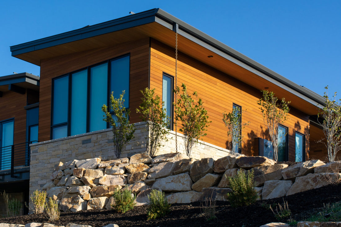 modern cabin exterior with cedar rainscreen cladding, visible air gap detail, mountain setting