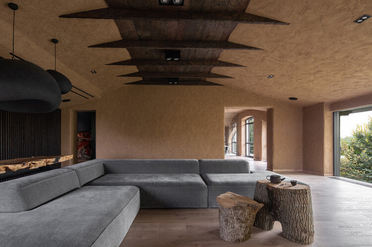 wabi-sabi cabin interior with aged timber, raw linen textiles, unglazed ceramics, soft natural light